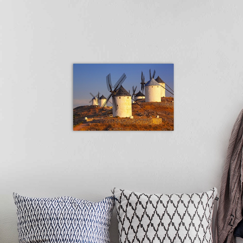 A bohemian room featuring Spain, Castilla-La Mancha, Consuegra, Windmills near the village, sunrise