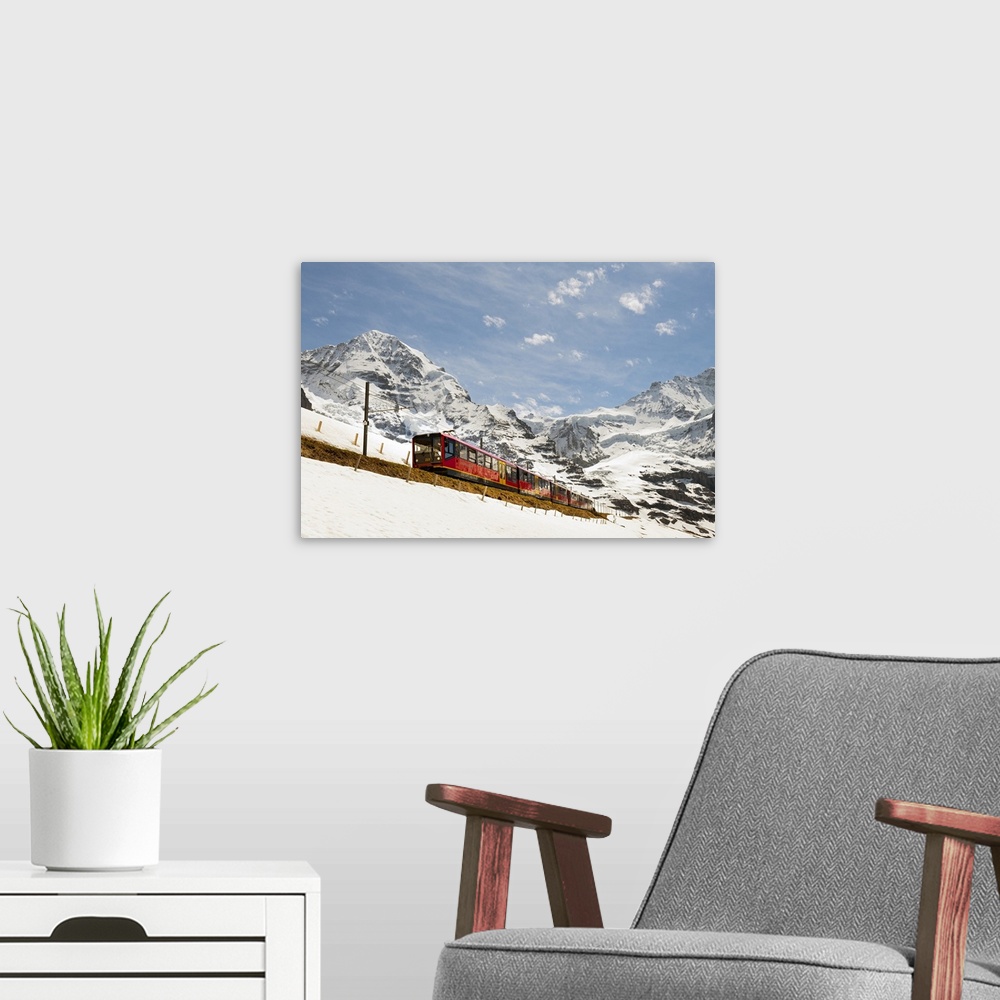 A modern room featuring Switzerland, Bern, Berner Oberland, Alps, Bernese Oberland, Jungfraujoch, Train passing through t...
