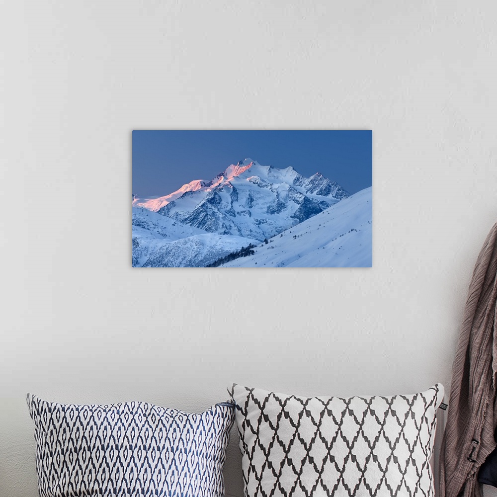 A bohemian room featuring Switzerland, Valais, Alps, Blatten, Mischabel Group with the Dom Mountain (4545 m) at sunrise.