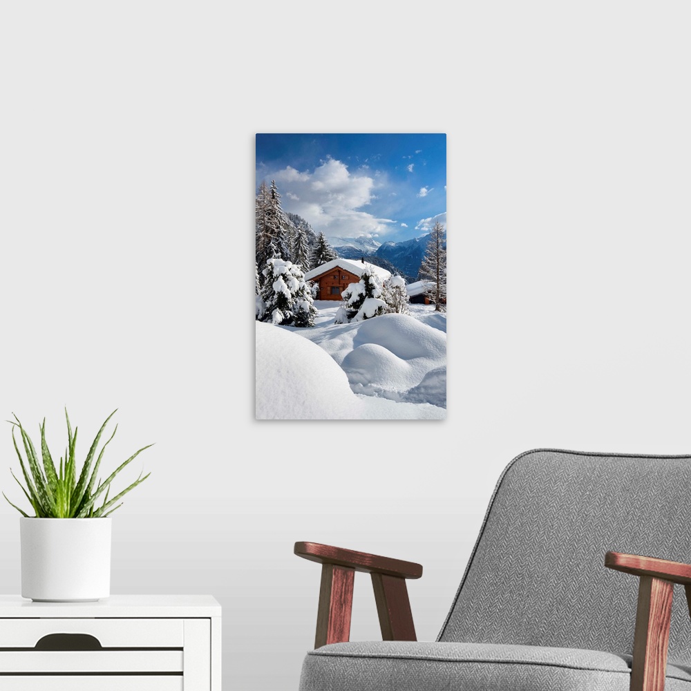 A modern room featuring Switzerland, Valais, Alps, Blatten, Snow covered chalet.