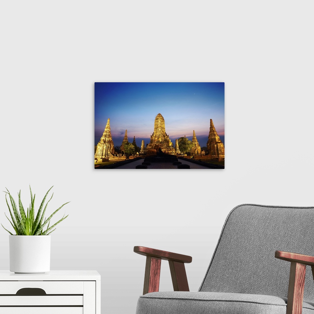 A modern room featuring Thailand, Southeast Asia, Ayutthaya, Wat Chai Watthanaram at sunset
