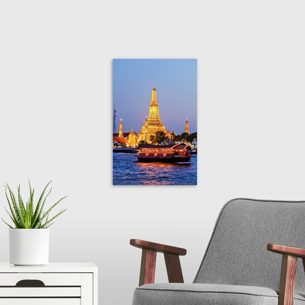 A modern room featuring Thailand, Thailand Central, Bangkok, Wat Arun or Temple of Dawn illuminated at dusk.