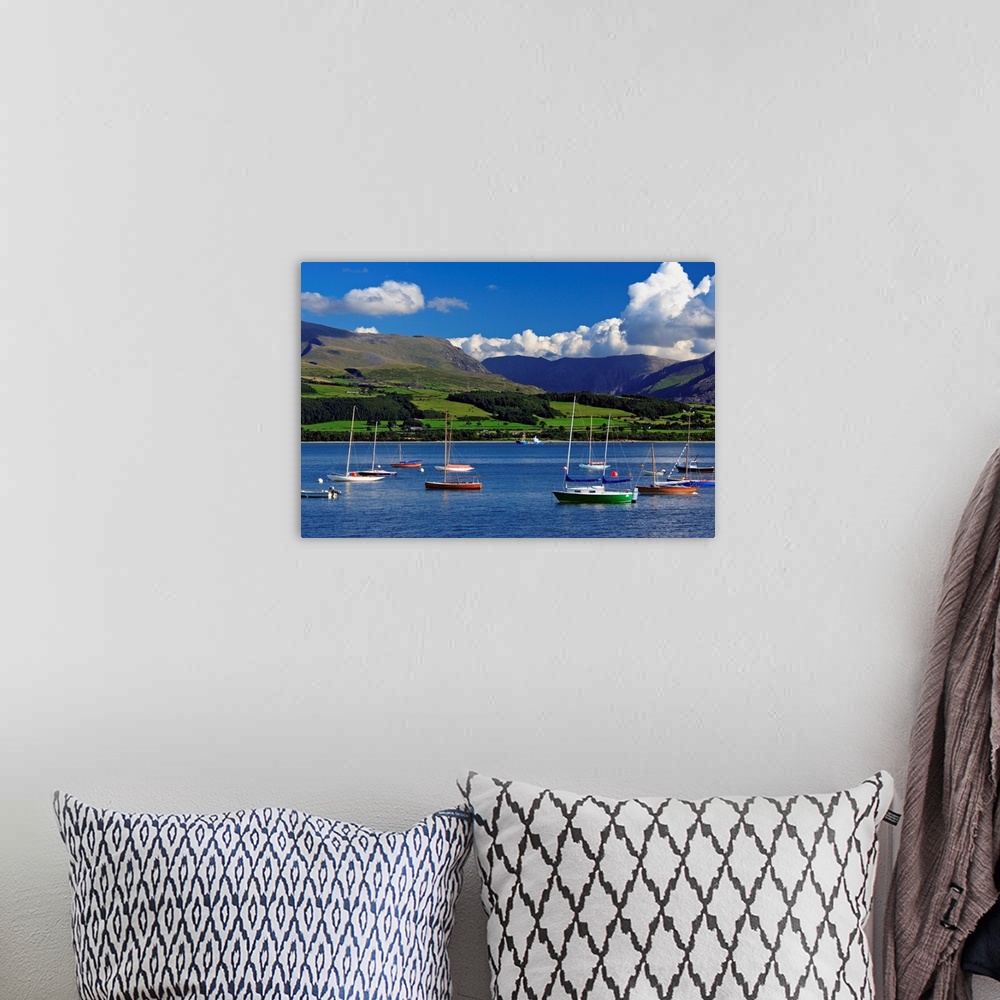 A bohemian room featuring UK, Wales, Anglesey, Sailing boats in the Menai Strait, with the Snowdon range