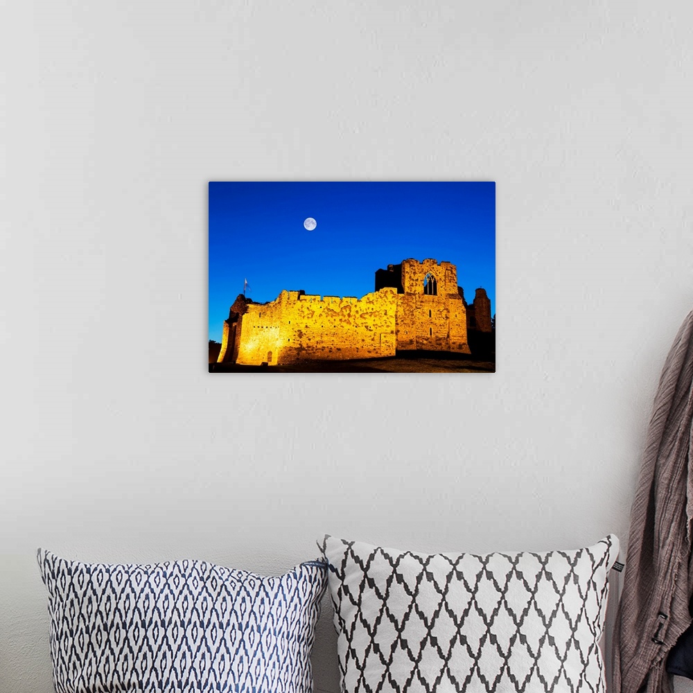 A bohemian room featuring UK, Wales, Gower Peninsula, Oystermouth Castle at Mumbles near Swansea by night.