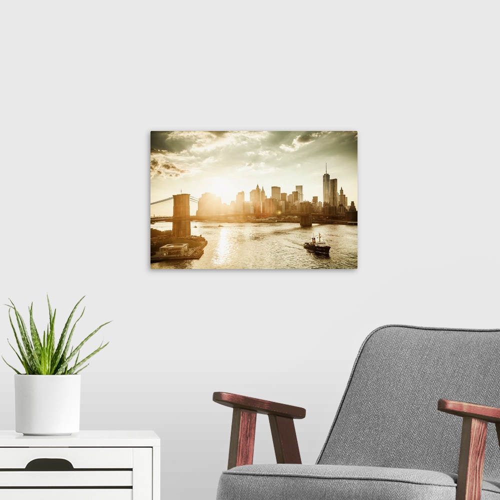 A modern room featuring USA, New York City, Brooklyn Bridge and Manhattan skyline at sunset with One World Trade Center a...