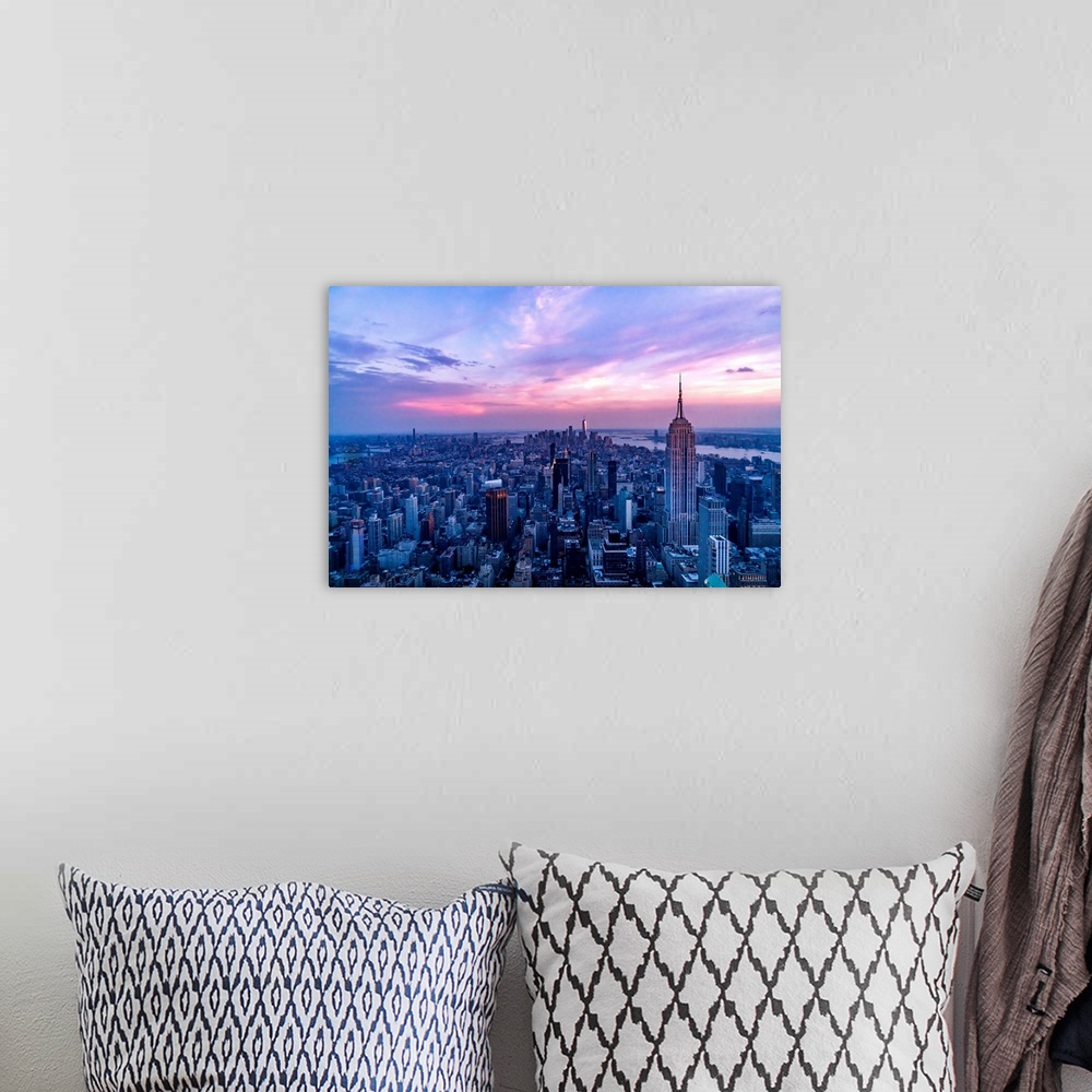 A bohemian room featuring USA, New York City, Manhattan, Empire State Building, dramatic pink sky and light over Manhattan.