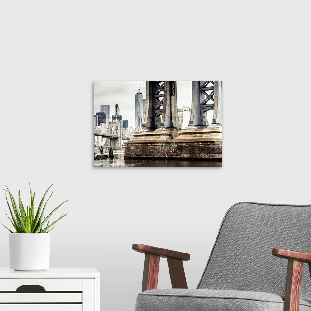 A modern room featuring USA, New York City, Manhattan Bridge pylon, Brooklyn Bridge and Freedom Tower in background.