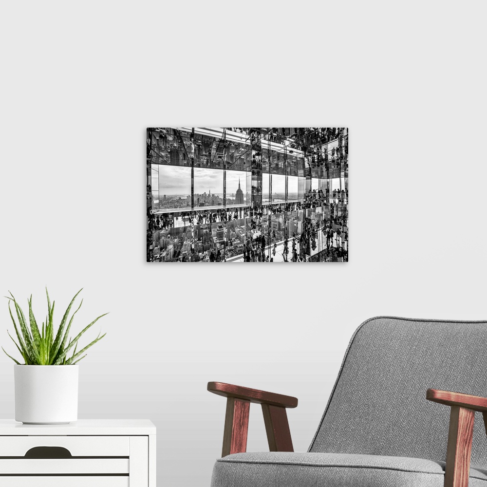A modern room featuring USA, New York City, Manhattan, black and white mirrored view inside Summit Building, people walki...