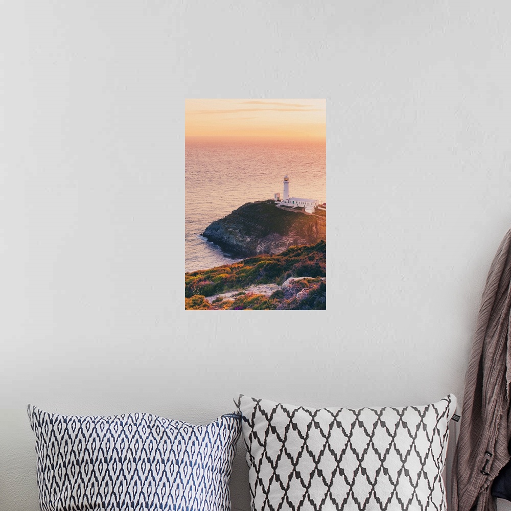 A bohemian room featuring Wales, Anglesey, Great Britain, British Isles, South Stack Lighthouse in North Wales at sunset on...