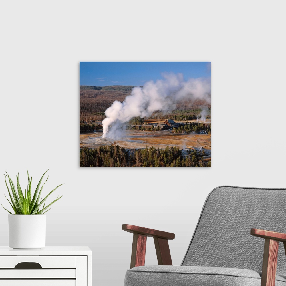 A modern room featuring United States, USA, Wyoming, Yellowstone National Park, Old Faithful Geyser erupting in the morni...