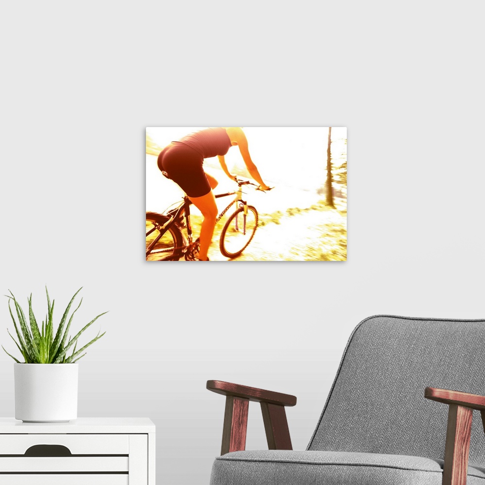 A modern room featuring Young woman mountain biking