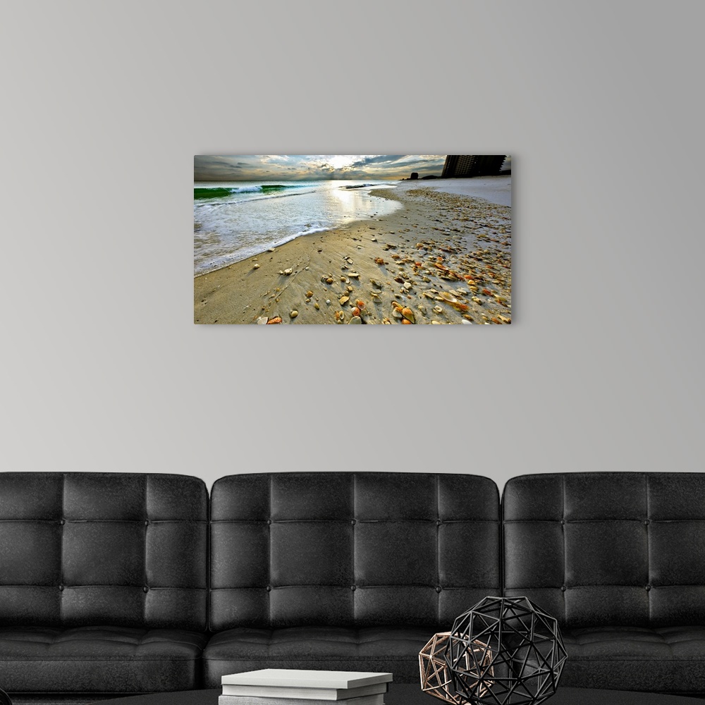 A modern room featuring A sandy shell covered shore before a bright sunset. A very tranquil and relaxing Florida vacation...