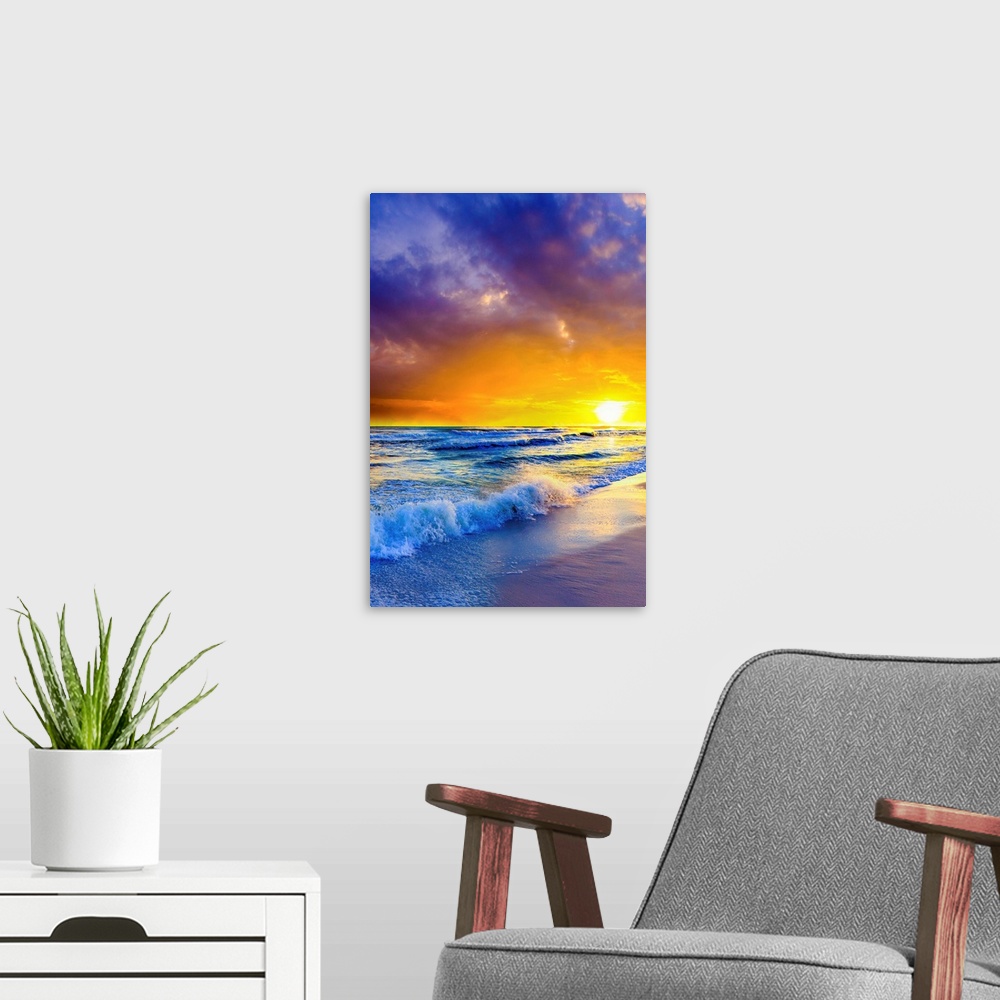 A modern room featuring Purple clouds reach out beyond an orange sunset over the ocean. A great sunset to print on canvas.