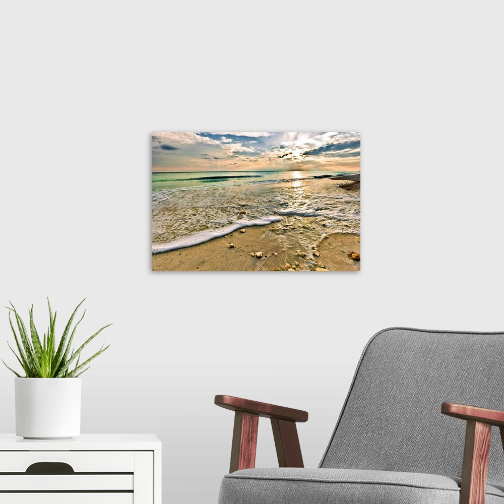 A modern room featuring Landscape photography of a beautiful beach sunset with a green seascape. This picture is titled S...