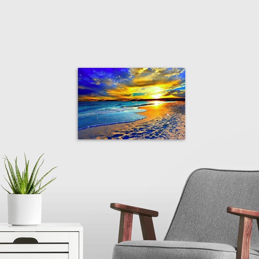A modern room featuring A magnificent orange sunset over the beach and blue sea. Orange clouds fill the sky with color ov...