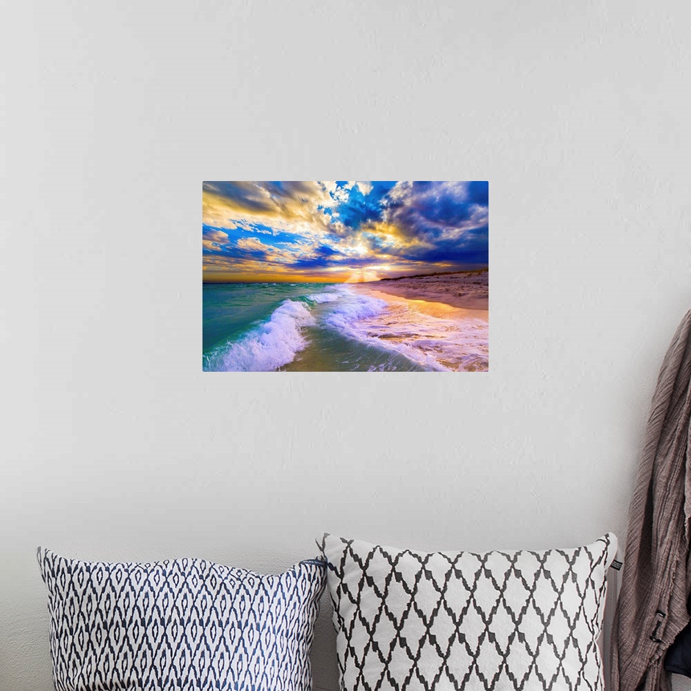 A bohemian room featuring Breaking waves over a blue beach under a sunset in Florida.