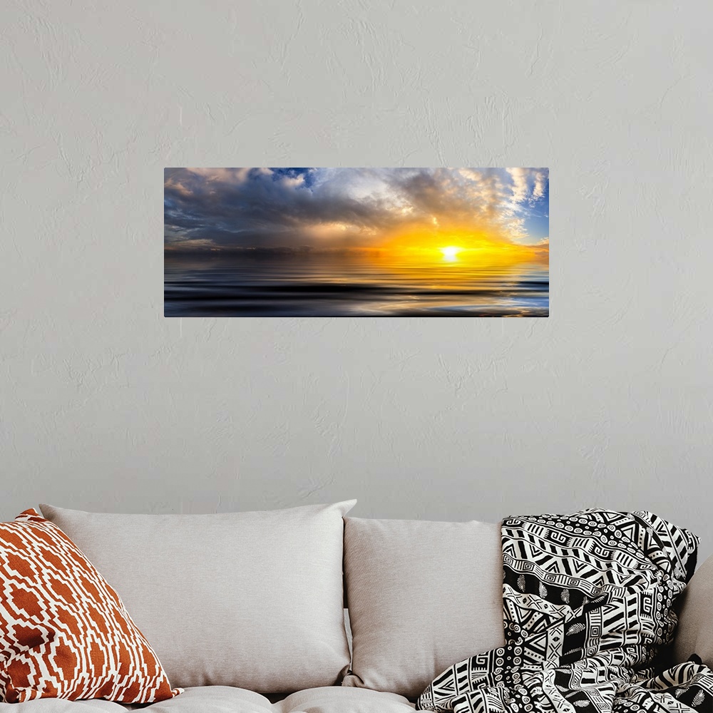 A bohemian room featuring A beautiful golden panoramic sunset reflected in the ocean waves at sunset with bright spiraling ...