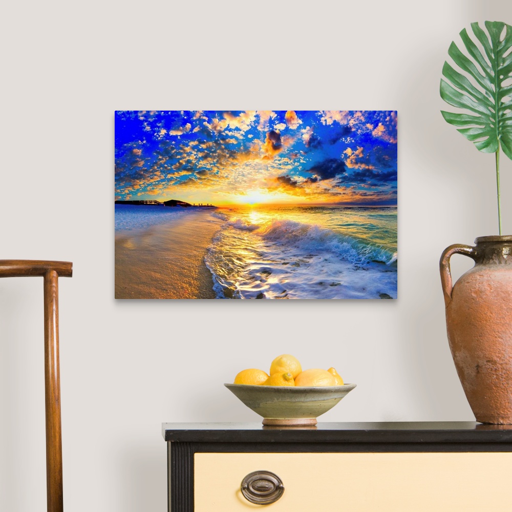 A traditional room featuring Ocean landscape photograph of a beautiful ocean sunset.
