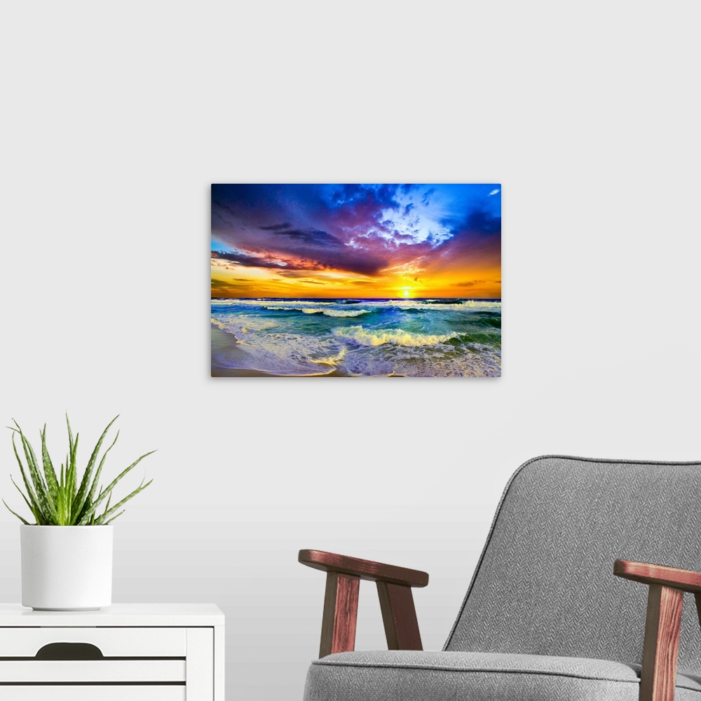 A modern room featuring A beautiful sunset sea in this Purple Sunset landscape. Waves roll into the beach before a beauti...