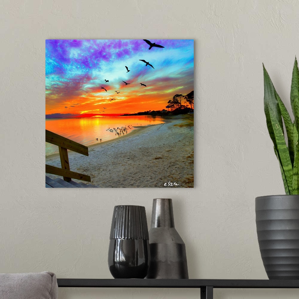 A modern room featuring An orange sunset with birds soaring and a bright sunset reflection.