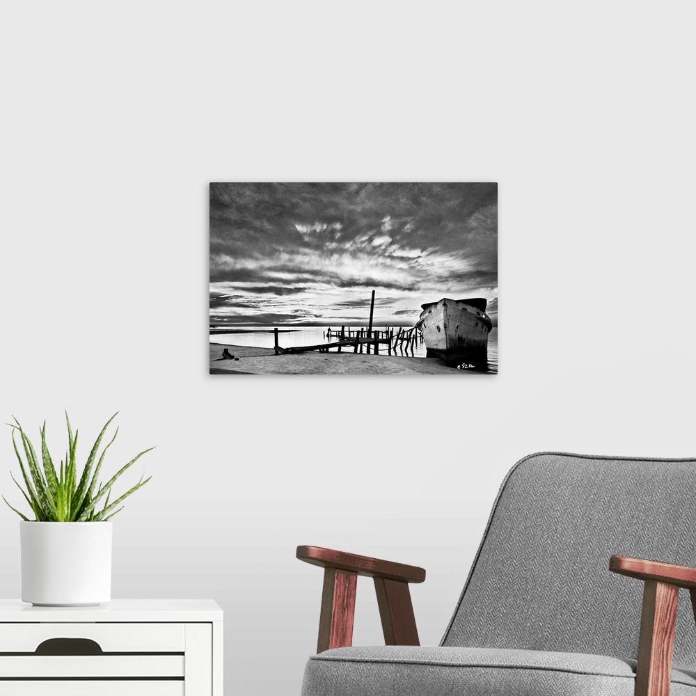 A modern room featuring A black and white shipwreck landscape in Navarre, Florida.