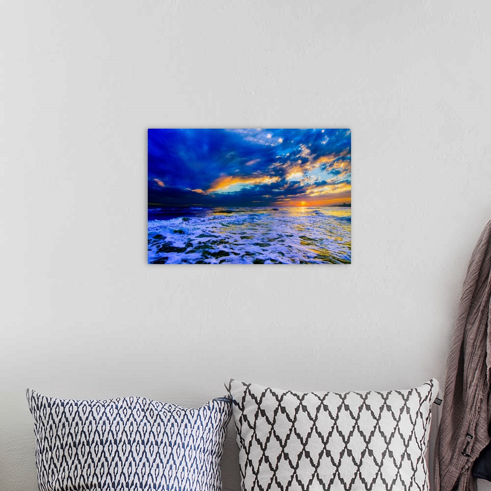 A bohemian room featuring A beautiful blue beach sunset in this landscape seascape photo. An art print featuring a blue sea...