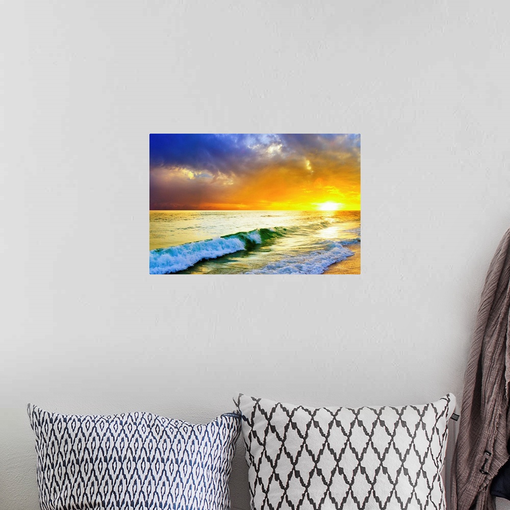 A bohemian room featuring Waves breaking from an emerald sea beneath an orange and blue ocean sunset with green sea surf.