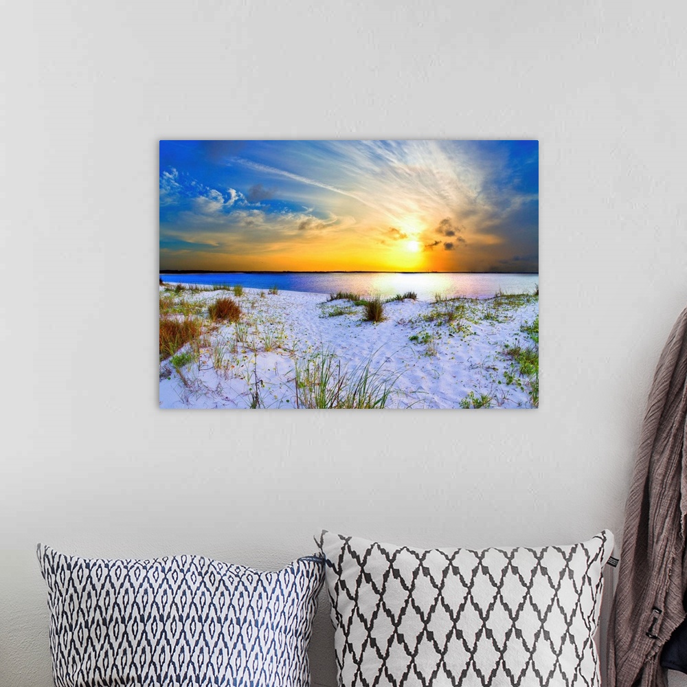 A bohemian room featuring An orange sunset with sweeping clouds over a white sandy beach landscape. Landscape taken near Na...