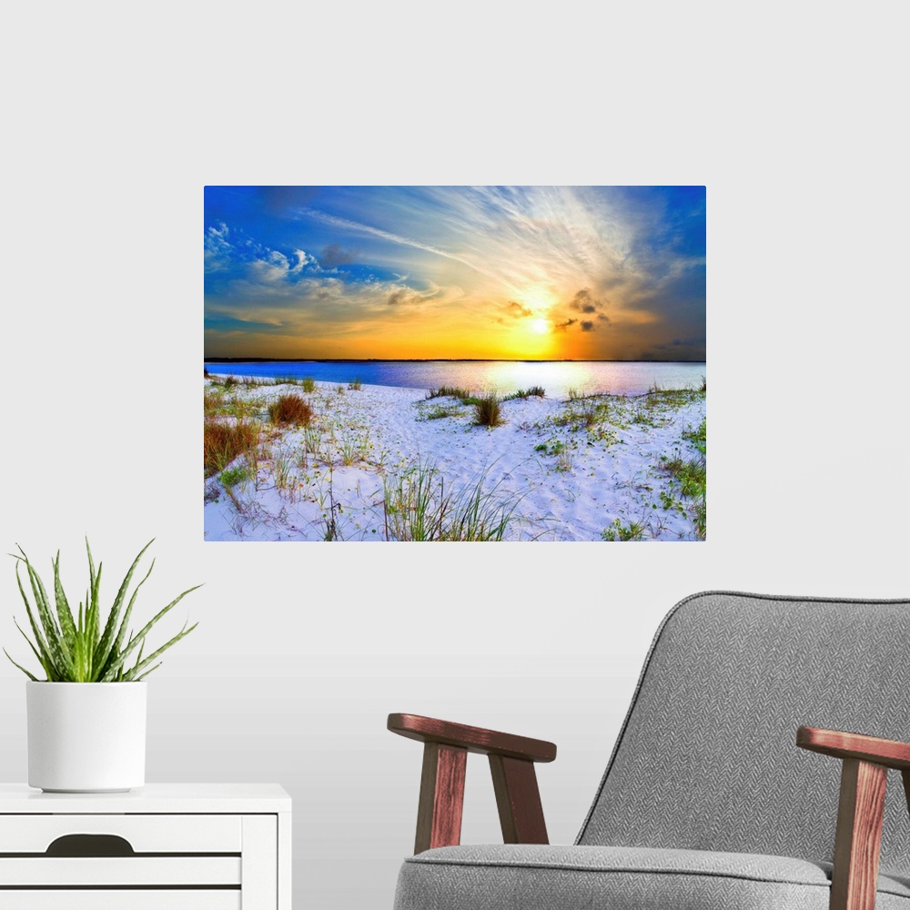 A modern room featuring An orange sunset with sweeping clouds over a white sandy beach landscape. Landscape taken near Na...