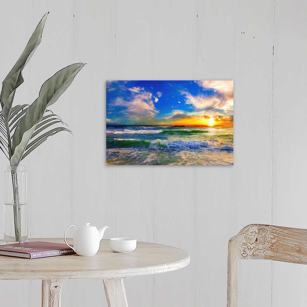A farmhouse room featuring A blue ocean sunrise with white crested waves. A colorful seascape sunset with an orange sun.