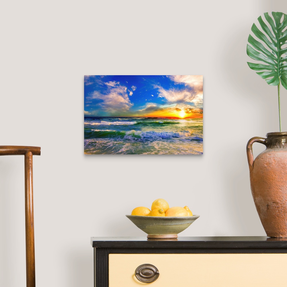 A traditional room featuring A blue ocean sunrise with white crested waves. A colorful seascape sunset with an orange sun.