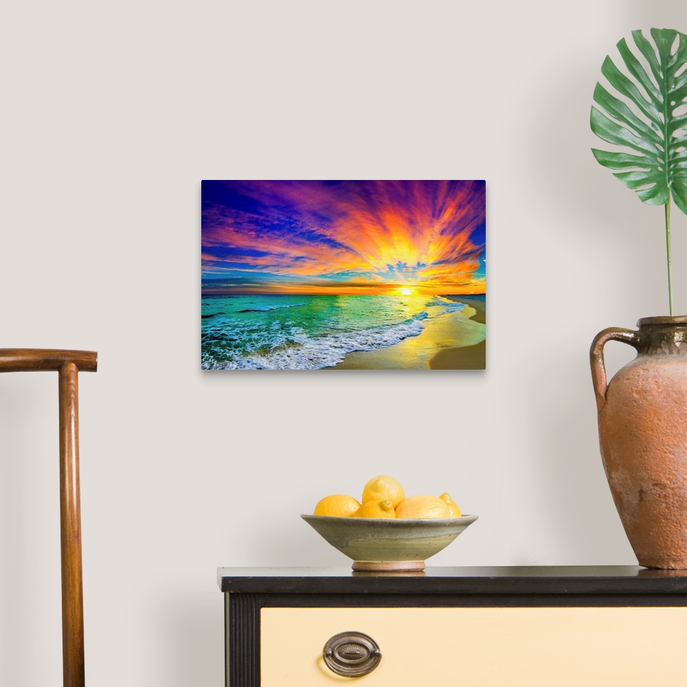 A traditional room featuring A landscape of a colorful ocean sunset in this green sea photo. An art print featuring waves on t...
