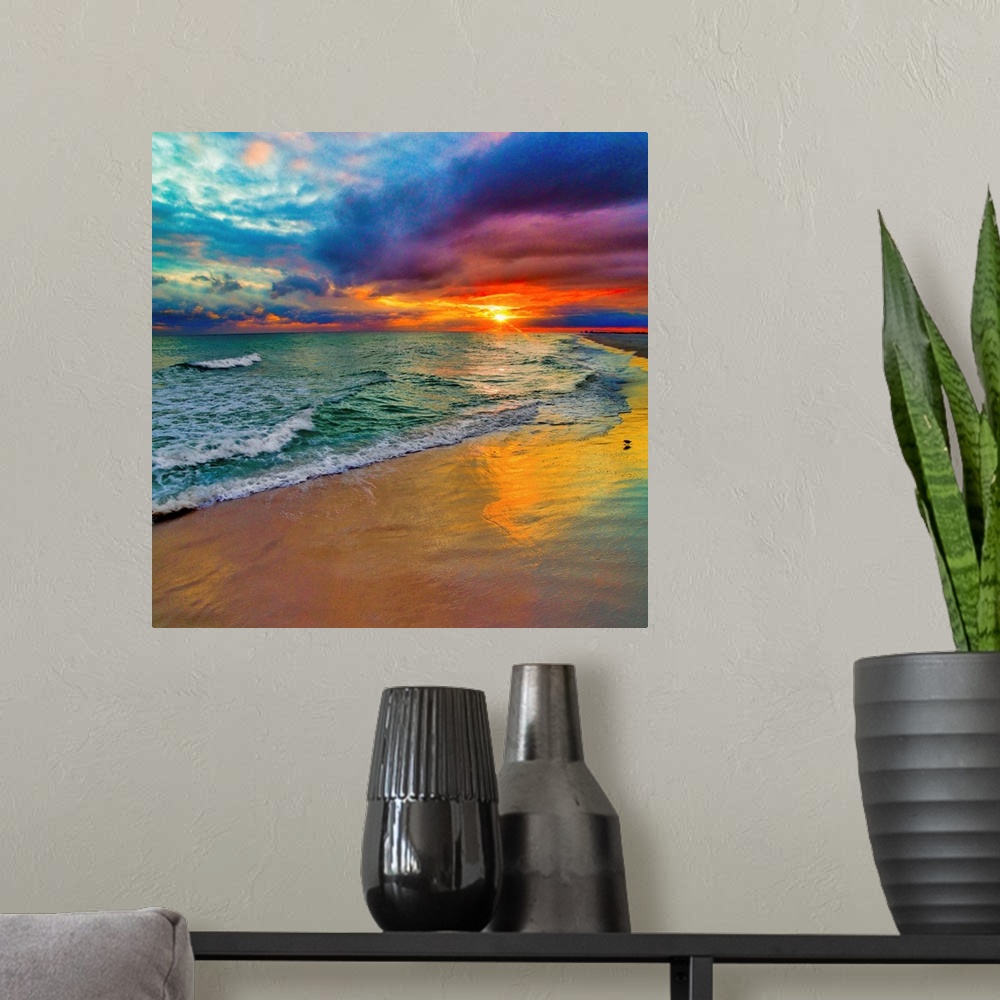 A modern room featuring A square image of the sun descending over the ocean amid bright, technicolor clouds.