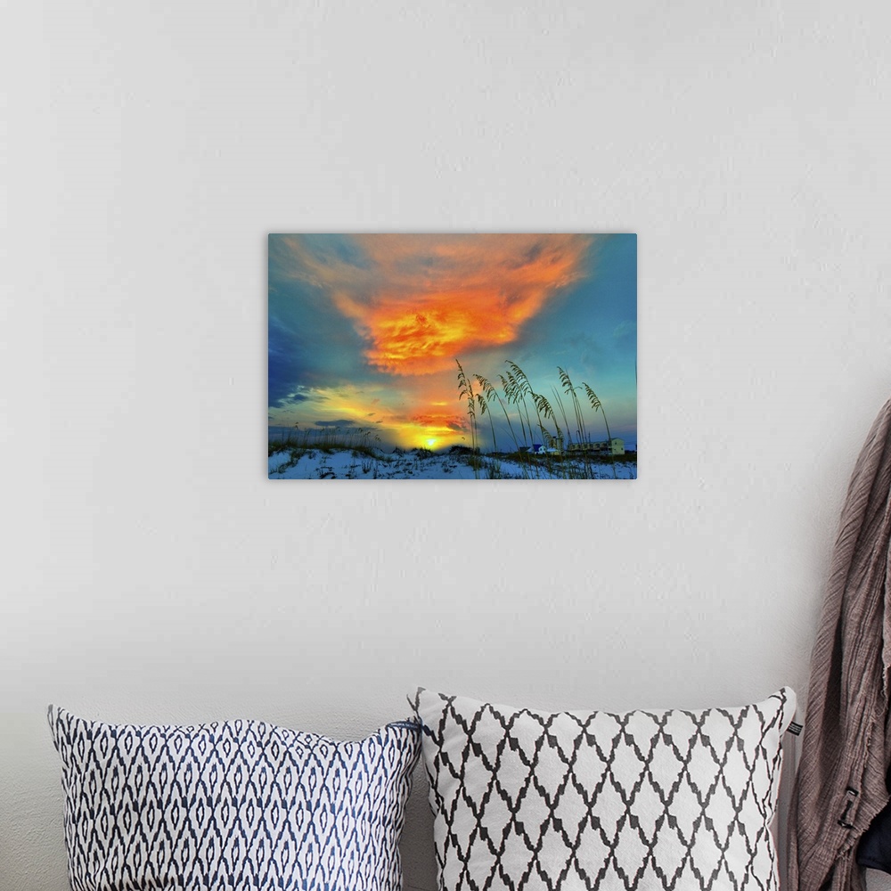 A bohemian room featuring A dark red cloud in this sunset over the dunes.