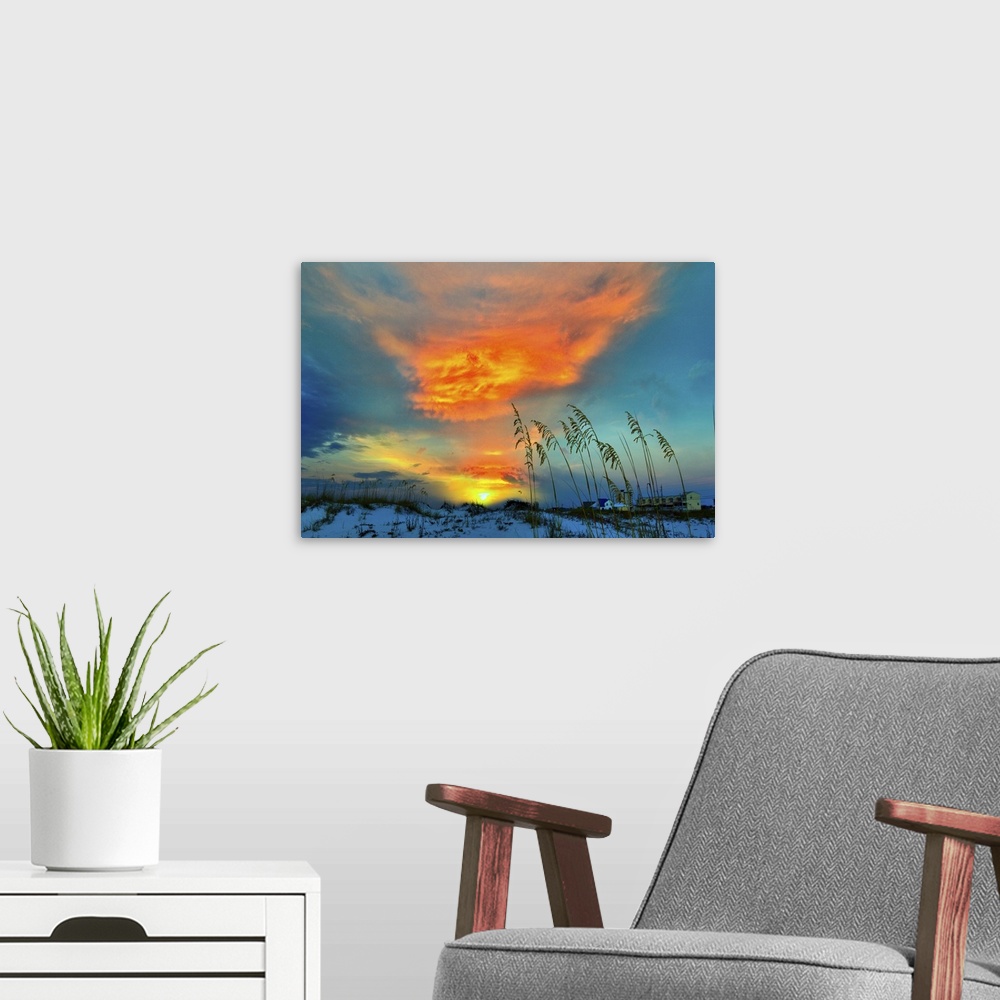 A modern room featuring A dark red cloud in this sunset over the dunes.