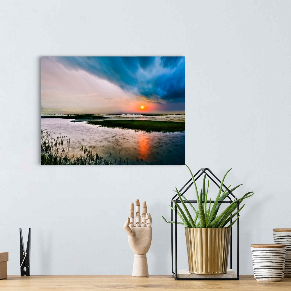 A bohemian room featuring A dark stormy sea sunset with rain on the waters surface.
