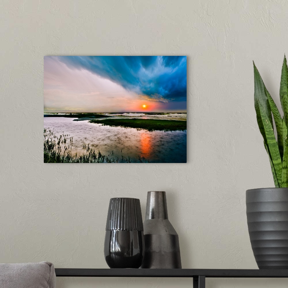 A modern room featuring A dark stormy sea sunset with rain on the waters surface.
