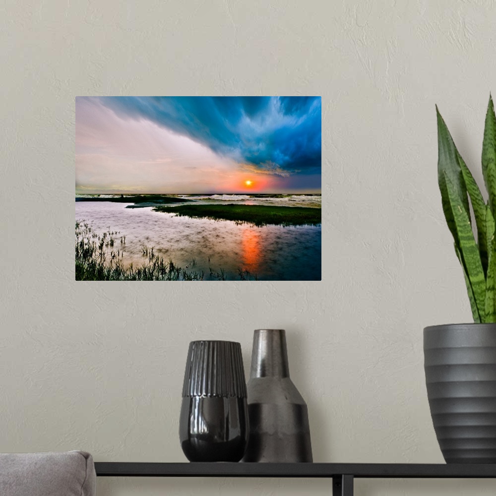 A modern room featuring A dark stormy sea sunset with rain on the waters surface.