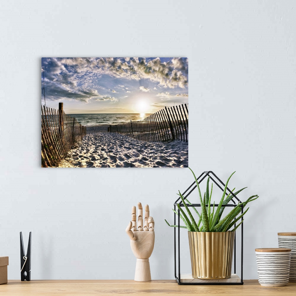 A bohemian room featuring Footprints in the sand along a heavily used path leading down to the beach. Landscape taken at Se...