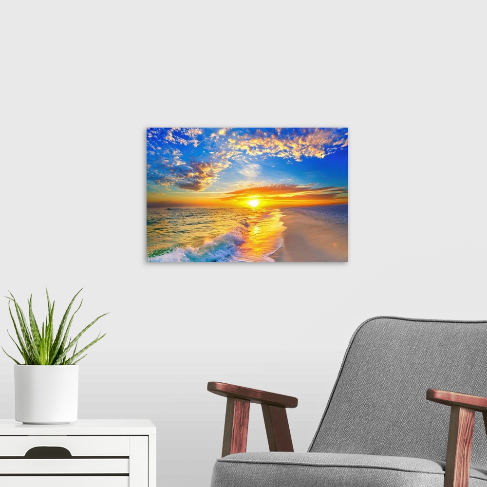 A modern room featuring Golden soaked waves on the beach under a blue sky and beautiful sunset.
