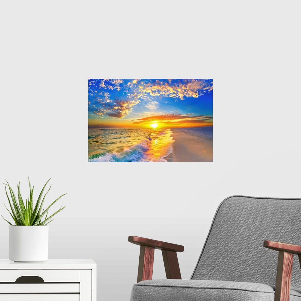 A modern room featuring Golden soaked waves on the beach under a blue sky and beautiful sunset.
