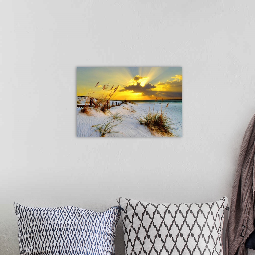 A bohemian room featuring Landscape photograph of a golden beach sunset along a beautiful coast. This golden sunset has mag...