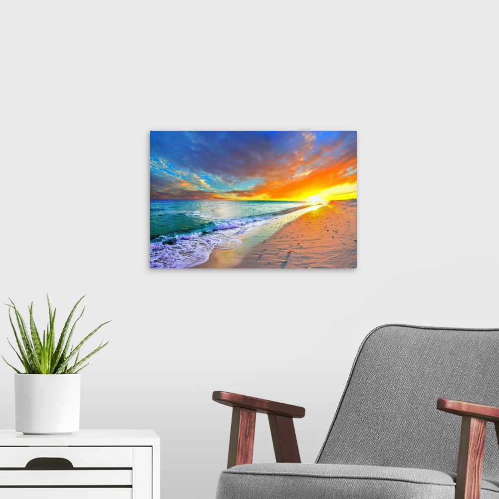 A modern room featuring Sea shells cast shadows on the shore next to a turquoise ocean with an orange sunset on the beach.