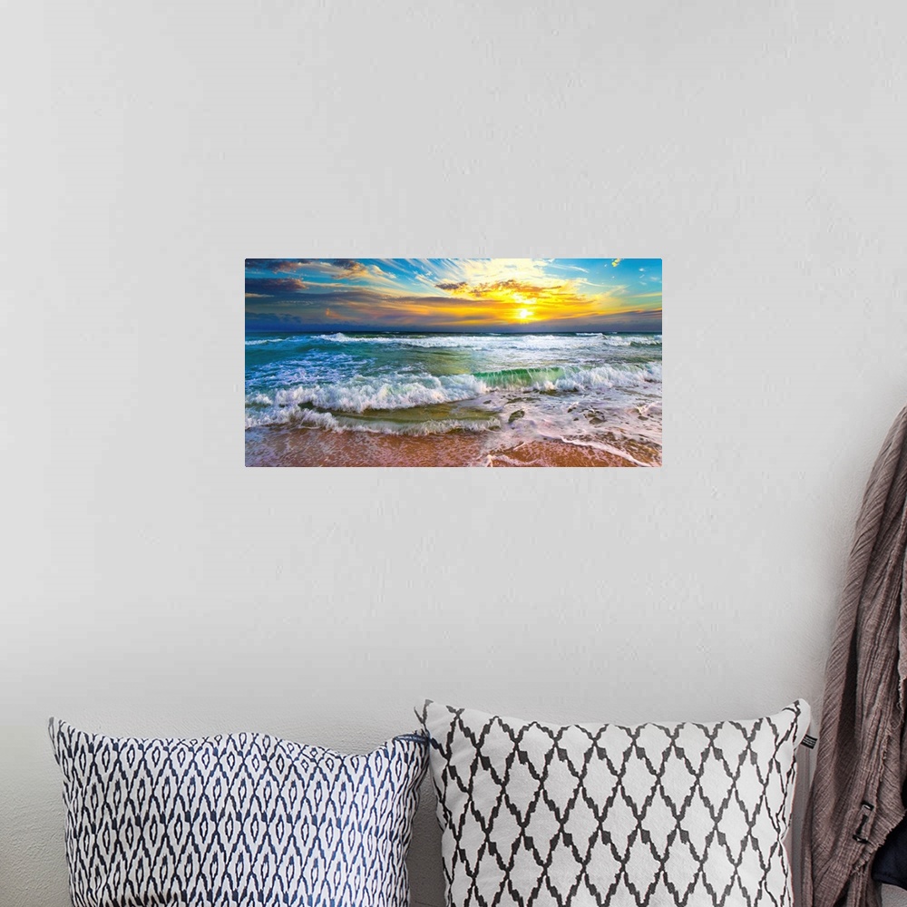 A bohemian room featuring This panoramic beach sunset features breaking waves on a beautiful sea shore. A wave crashes on t...