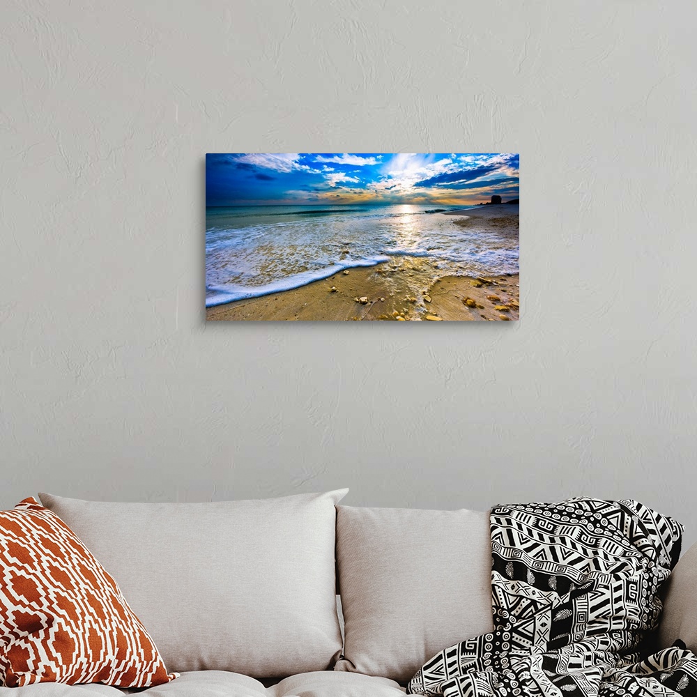 A bohemian room featuring Sunset over paradise in this panoramic beach landscape. A tranquil ocean landscape with sea shell...