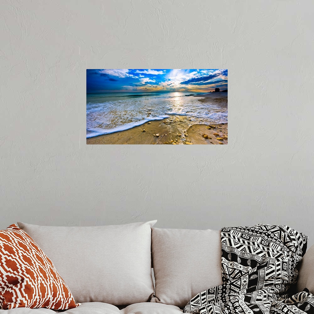 A bohemian room featuring Sunset over paradise in this panoramic beach landscape. A tranquil ocean landscape with sea shell...