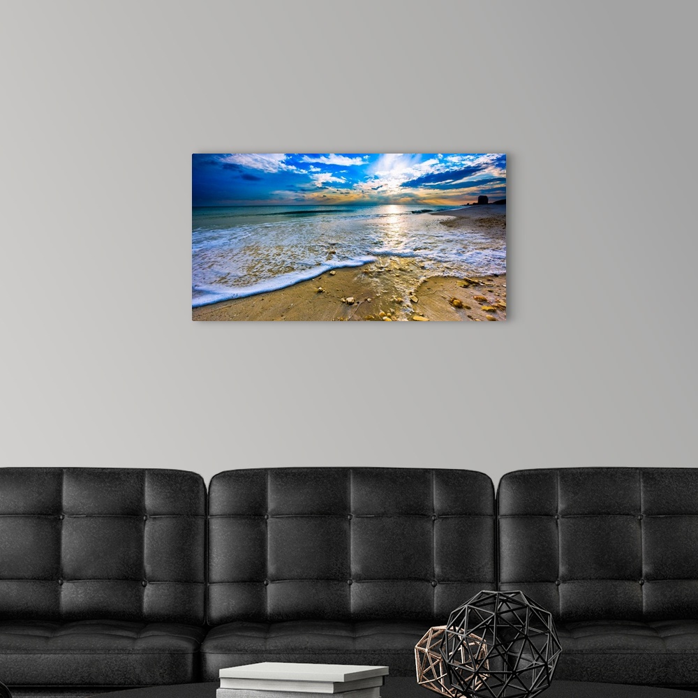 A modern room featuring Sunset over paradise in this panoramic beach landscape. A tranquil ocean landscape with sea shell...