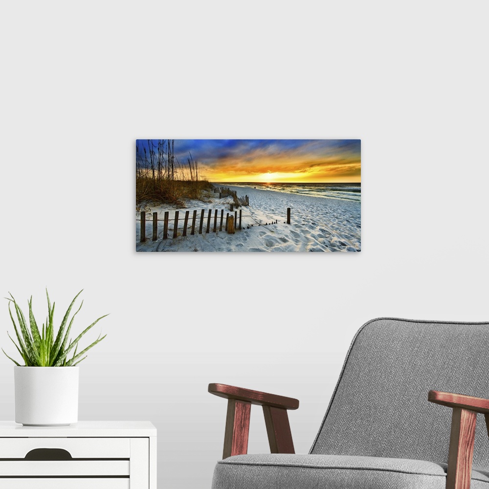 A modern room featuring White sandy shore in a panoramic landscape with a burning red sunset sky. Landscape taken on Nava...