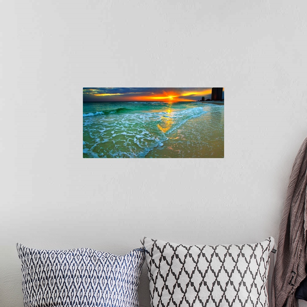 A bohemian room featuring Emerald waves and soft white foam. Dark yellow and red sunset seascape. Landscape taken on Navarr...