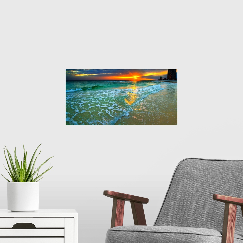 A modern room featuring Emerald waves and soft white foam. Dark yellow and red sunset seascape. Landscape taken on Navarr...